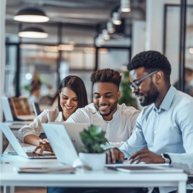 Sales team collaborating with digital tools in a modern office, emphasizing automation and efficiency